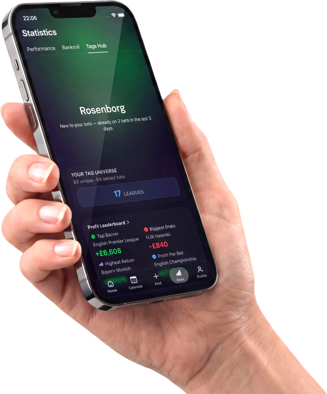 A hand holding a phone showing the Gara Statistics Tags Hub — a Rosenborg tag profile, a tag universe across 17 leagues, and a profit leaderboard.